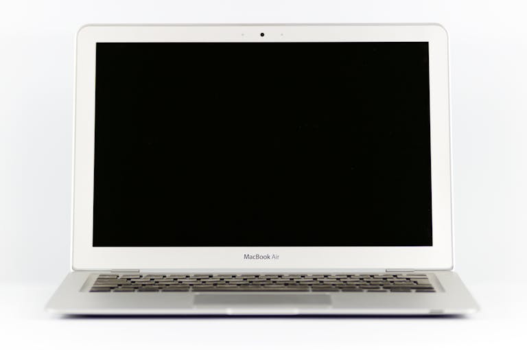 Front view of a MacBook Air laptop with a blank screen on a white background.