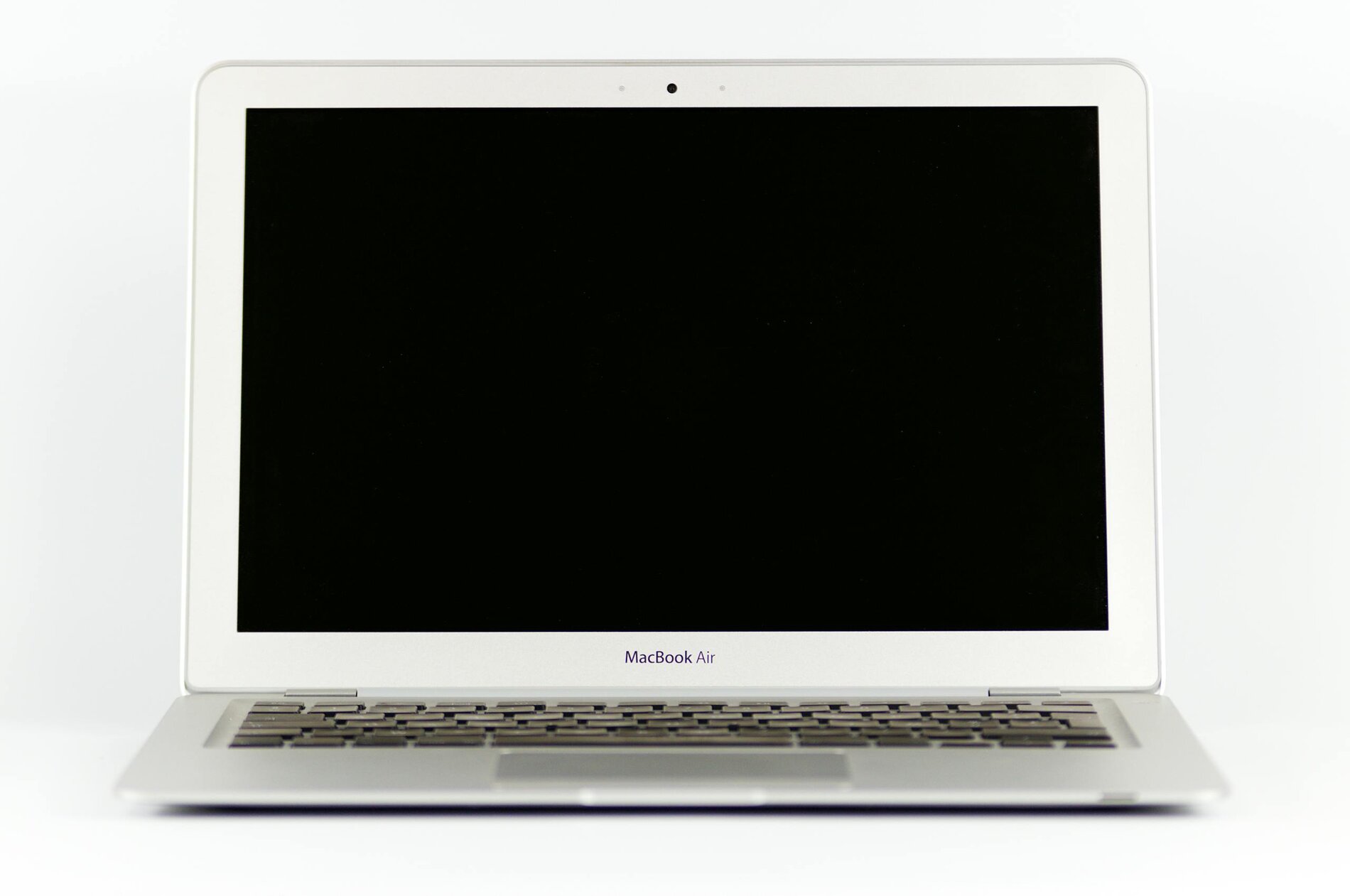 Front view of a MacBook Air laptop with a blank screen on a white background.
